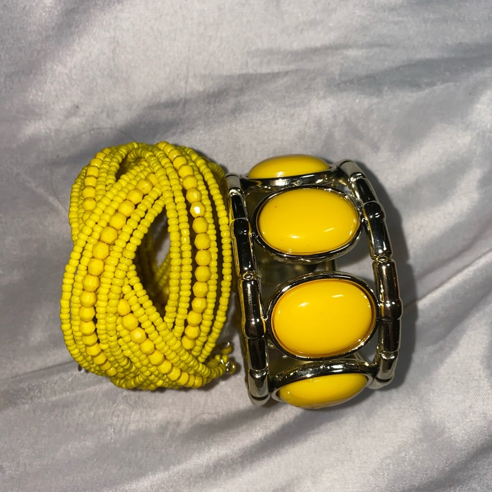 Two yellow bangles. Stretch with silver and yellow beads.